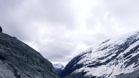 Establishing shot of valley under Nigardsbreen glacier Stock Footage 230225732