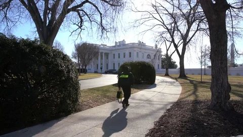 Establishing shot White House with Security person walking Stock Footage 85310855