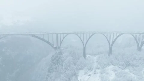 Establishing view of old arches bridge in winter season Stock Footage 256819077