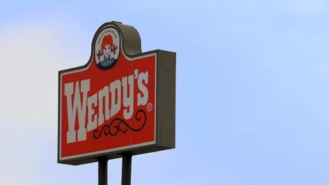 Establishing of Wendy's hamburger restaurant sign, Salt Lake City, Utah. Stock Footage