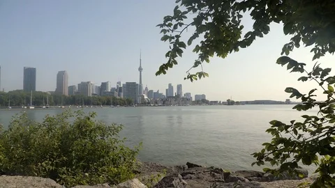 Establishing wide angle shot of Toronto skyline across Lake Ontario. Stock Footage 79190126