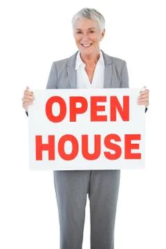 Estate agent holding sign for open house Stock Photos