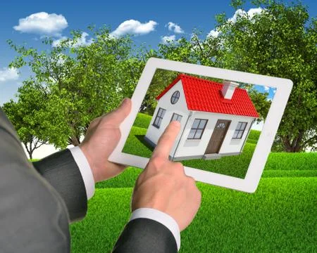 Estate agent using tablet with house on screen Stock Photos