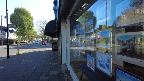 Estate agent window on British high street Stock Footage 221435858