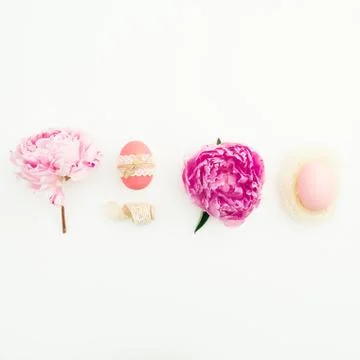Ester festive composition with eggs, pink peonies flowers on white background Foto stock