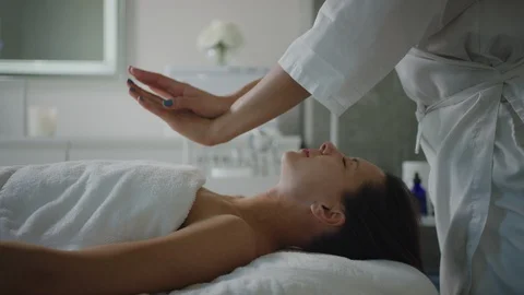 Esthetician massaging face, applying moisturizing cream Vídeo Stock 126341146