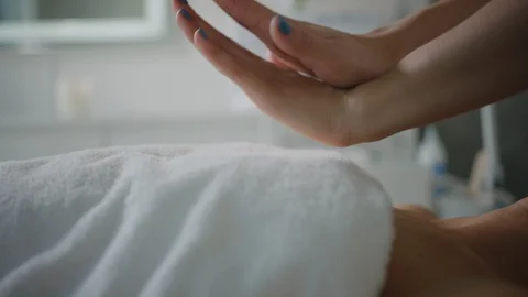 Esthetician massaging face, applying moisturizing cream Video stock 126341415
