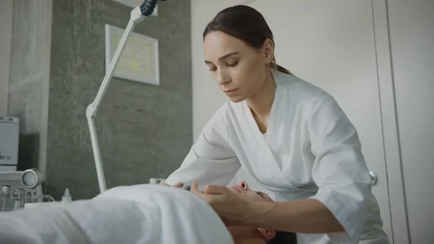 Esthetician massaging face Stock Footage 126341159