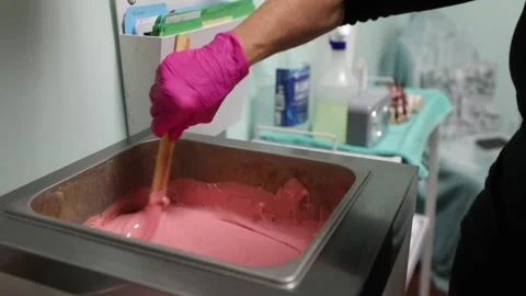 An esthetician waxes a client Stock Footage 141287986