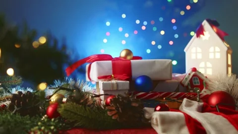 Estive Christmas composition with wrapped presents, garlands, and glowing holida Stock Footage 323672339