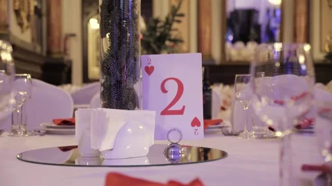Estive New Year's table. white dishes and glasses. christmas party.playing card Stock Footage 218602360