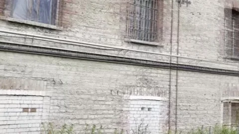 Estonia turns an old prison into its first museum about victims of communism, Ta Stock Footage 338118636