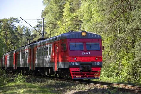ET2M electric train is moving in a forest strip Stock Photos