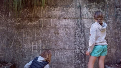Etching letters into a stone wall Stock Footage 132148955