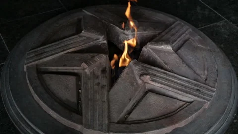 Eternal flame in memory of those killed in world war II Stock Footage 128872469