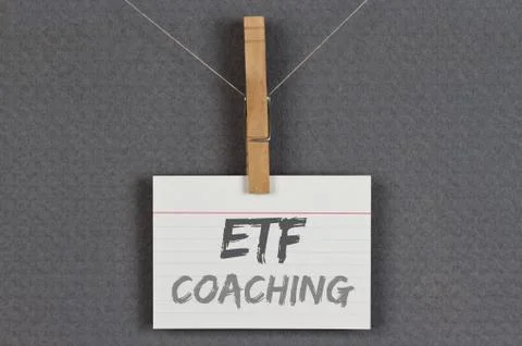 ETF coaching written on a note clipped on a grey pinboard Stock Photos