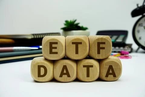ETF Data alphabet letters with calculator and alarm clock on white background Stock Photos