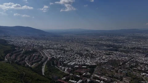 An Ethereal Drone Glide Over Bursa Unveils a Winding Path Through Verdant Hill Stock-Footage 314076587