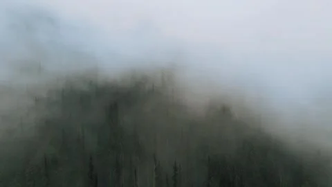 Ethereal Elevation: Drone's Eye View of Fast-Moving Foggy Hazy Clouds Stock Footage 244121922