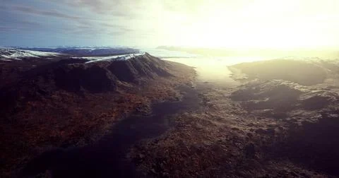 Ethereal landscape with distant mountains and glowing horizon at sunset Stock Illustration