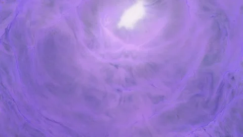 Ethereal light patterns dance in swirling purple hues during celestial events at Stock Footage 289811699