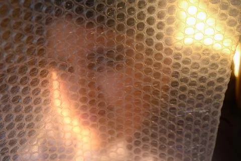 Ethereal Portrait Behind Bubble Wrap 스톡 사진