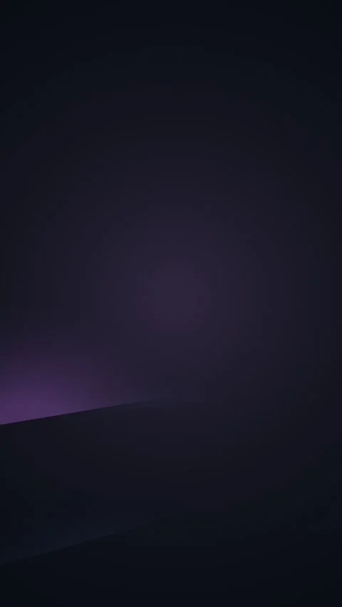 Ethereal purple light gradually illuminates a dark, mysterious space Stock Footage 327942485