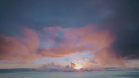 Ethereal sunset over the ocean, with soft, glowing golden light breaking through Stockbeeldmateriaal 335711822