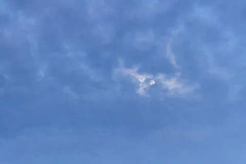 Ethereal Wispy Luminous Cloud Formation Glowing in Dark Moody Overcast Sky .. 스톡 사진