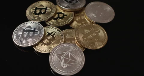Ethereum and Bitcoin on dark surface. Gold and silver coins, digital money Stock Footage 172055479