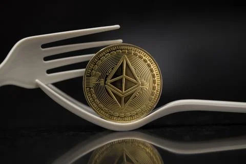 Ethereum Classic placed on Plastic Fork Stock Photos