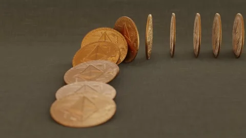 Ethereum coins fall over in chain reaction Stock Footage 165251992