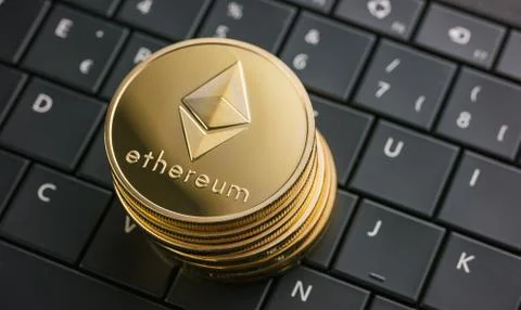 Ethereum coins stack cryptocurrency, digital money on computer keyboard Fotos Stock