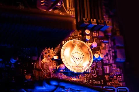 Ethereum Cryptocurrency coin on a PC computer motherboard, crypto currency mi Stock Photos