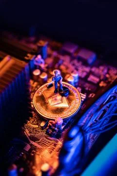 Ethereum Cryptocurrency coin on a PC computer motherboard, crypto currency mi Stock Photos