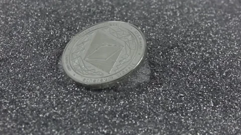Ethereum cryptocurrency falls on silver sequins. Stock Footage 155544117