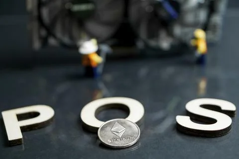 Ethereum Cryptocurrency switching from POW GPU mining to POS, POS sign with Stock Photos