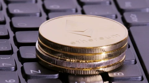 Ethereum mining. Cryptocurrency on laptop keyboard Stock Footage 86382978