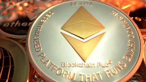 Etherium ETH, Bitcoin BTC, Ripple XRP and many other cryptocoins on golden light Stock Footage 129608528