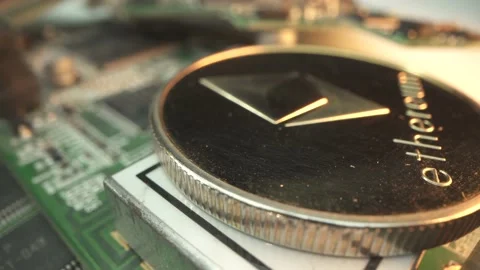 Etherium in macro shot on asic motherboard. Mining concept. popular crypto coin Stock Footage 143377341