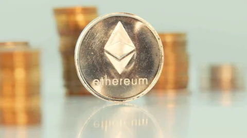 Etherium rotating with columns of coins. Loop. Stock Footage 90040131