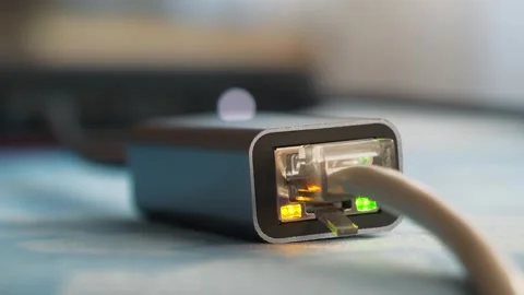 Ethernet cable adapter. Internet cable through an adapter connected to laptop Stock Footage 277349052