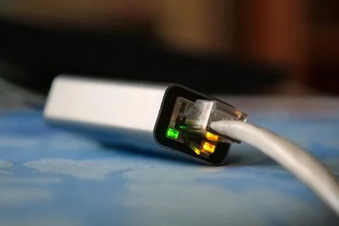 Ethernet cable adapter. Working ethernet cable adapter with green and yello.. Stock Photos