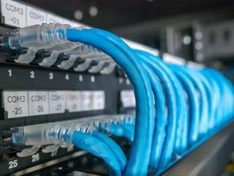 Ethernet cables and path panel in rack cabinet Stock Photos