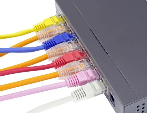 Ethernet cables connected to Desktop Switch or routerboard Stock Photos