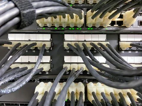 Ethernet cables connected to the network equipment Stock Photos