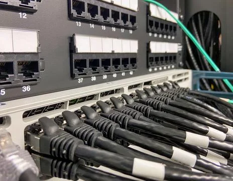 Ethernet cables connected to the network equipment Stock Photos