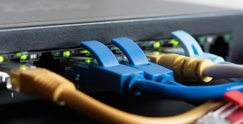 Ethernet cables connected to network switch Foto stock