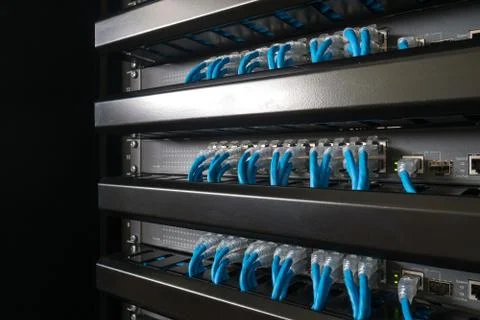 Ethernet network switch and network wire in rack cabinet Stock Photos