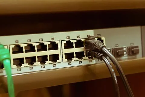 Ethernet rj 45 cable and network switch used to connect to the Internet Stock Photos